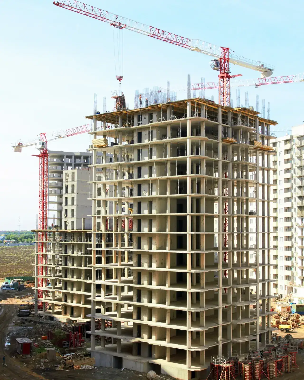 Concrete core and formwork rising against an overcast sky